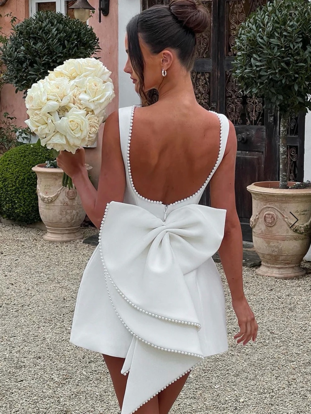 Backless White Mini Dress with Bow Detail wedding reception